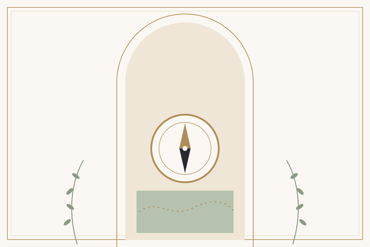 A brass compass on a pale table