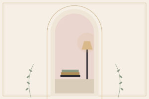 A floor lamp beside a stack of books