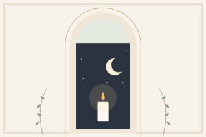 A single candle glowing beneath a crescent moon