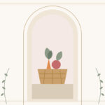 A woven basket with carrots, leaves, and a tomato