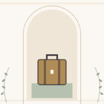 A tan suitcase with dark straps