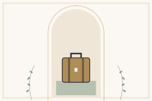 A tan suitcase with dark straps