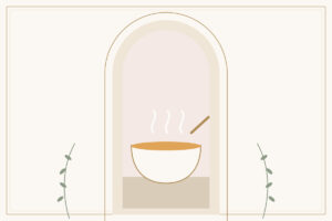 A steaming bowl of golden soup with a spoon
